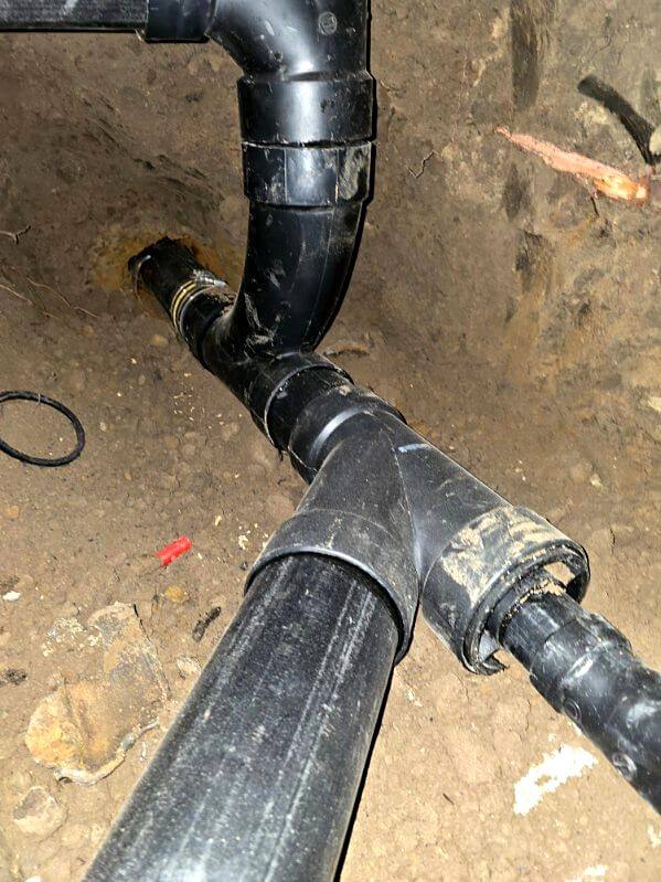 New ABS wye fitting on a sewer line in an open trench