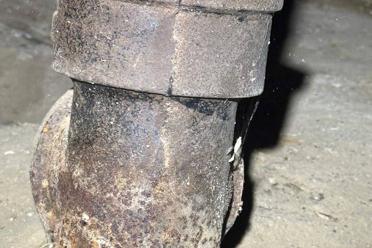 Corroded cast iron drain pipe found during a sewer inspection